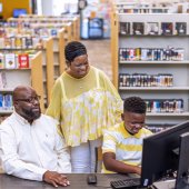 A family takes advantages of the resources available at the Pelham Public Library.