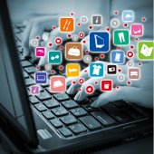 Hands on a computer keyboard with icons representing various online shopping sites.