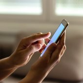 Hands holding a smartphone