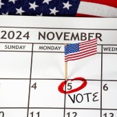 A calendar image for November 2024 with the date of November 5th circled in red and "vote" written on the calendar.