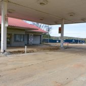 Image shows abandoned gas station on Pelham Parkway.
