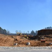 Construction equipment moving dirt for a new neighborhood in Pelham.